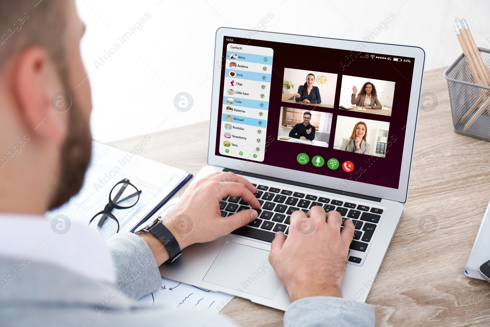 Image of Man having online meeting with his team via laptop, closeup