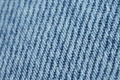 Photo of Light blue denim as background, closeup view