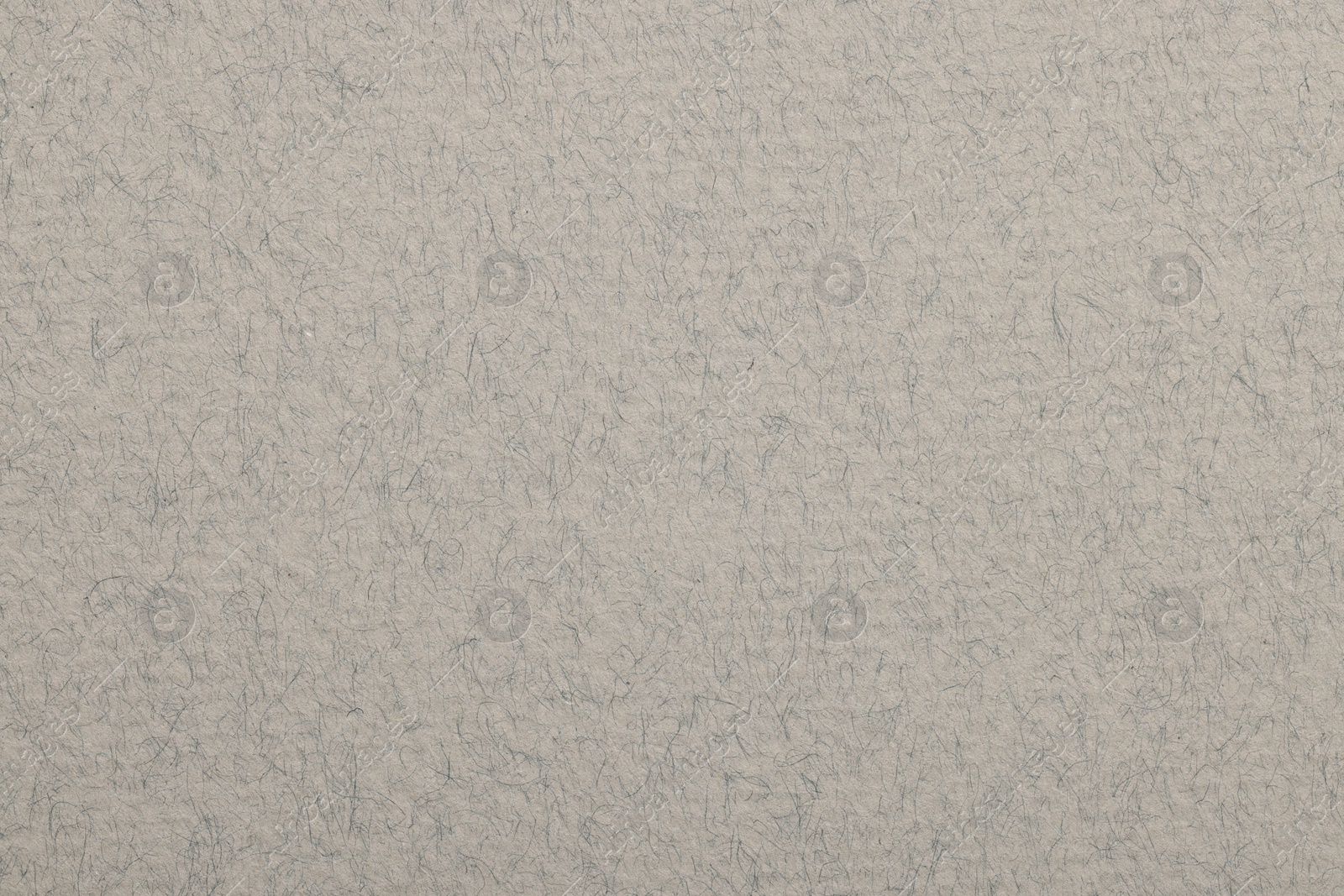 Photo of Texture of light grey paper sheet as background, top view