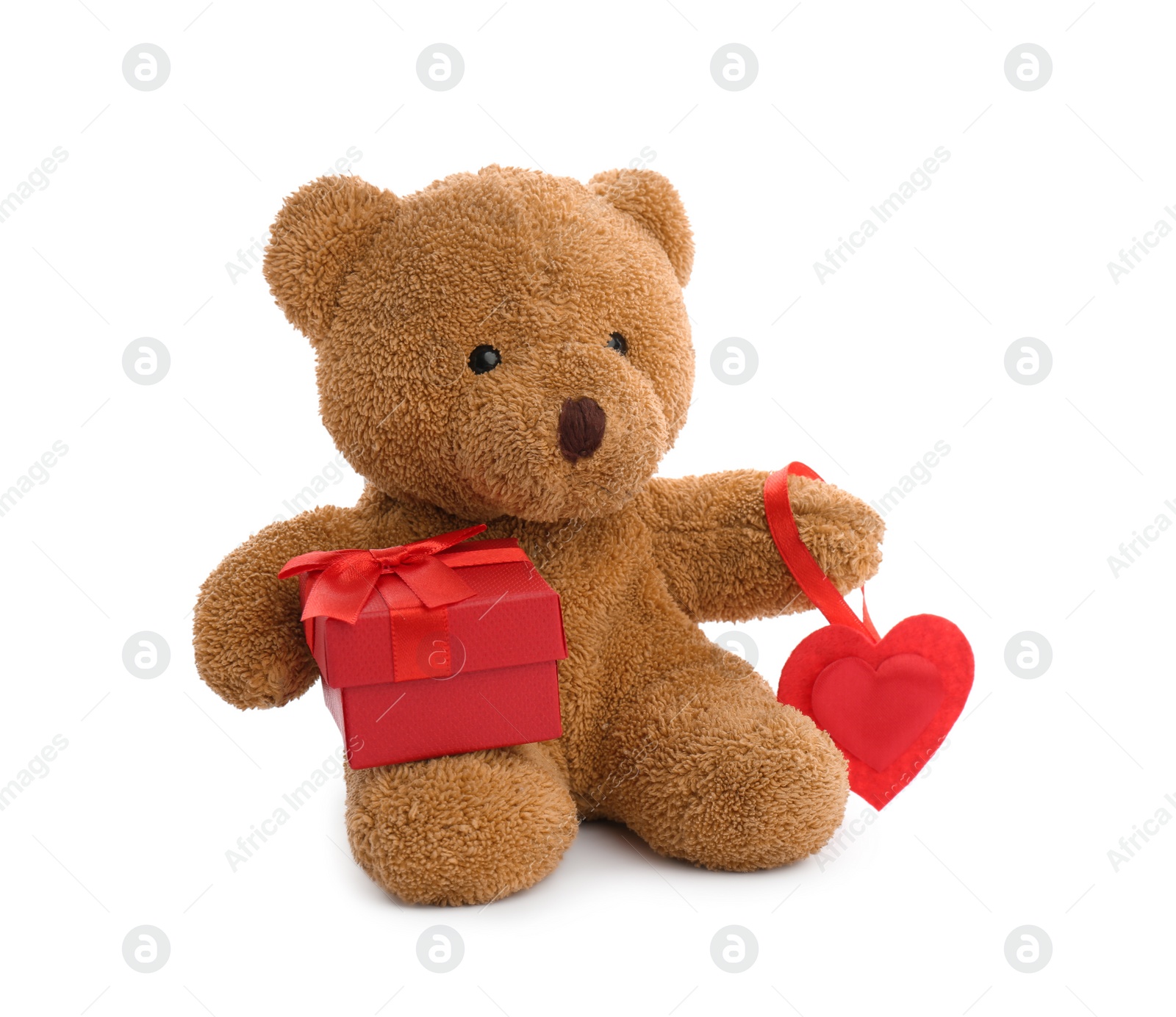 Photo of Cute teddy bear with red heart and gift box on white background. Valentine's day celebration