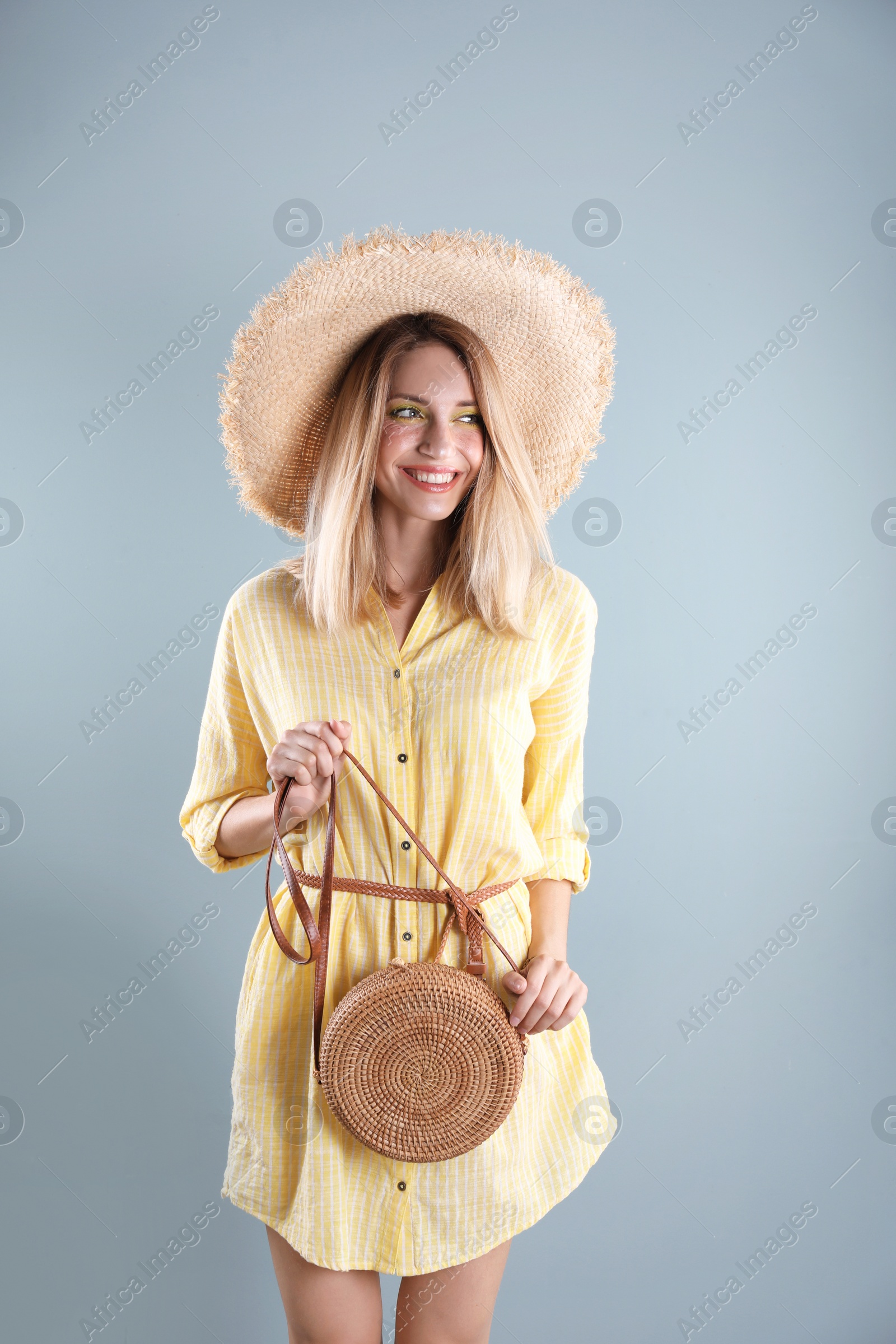 Photo of Beautiful young woman posing on color background. Summer fashion