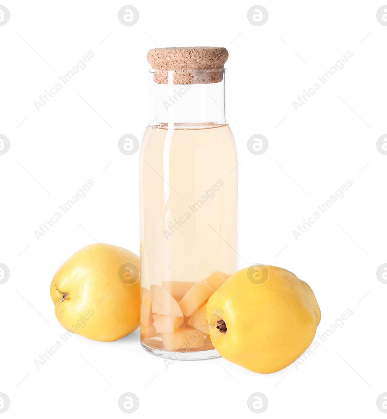 Photo of Tasty quince drink in glass carafe and fresh fruits isolated on white
