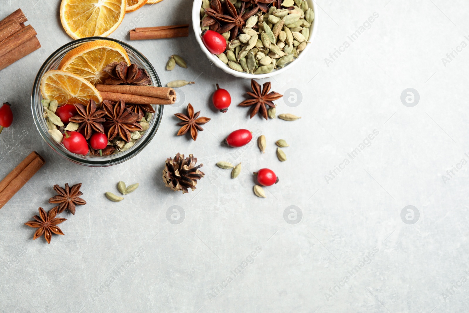 Photo of Aroma potpourri with different spices on white table, flat lay. Space for text