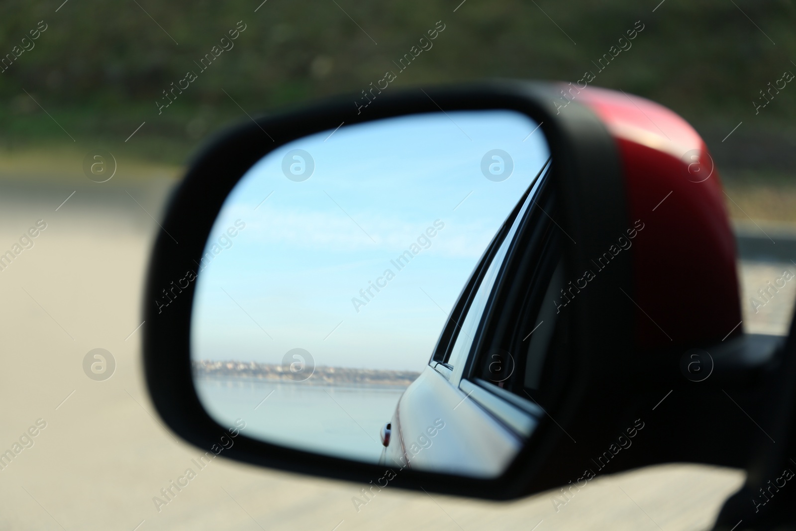 Photo of Side rear view mirror of modern car outdoors, closeup