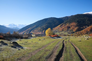 Picturesque view of empty pathway in mountains on sunny day