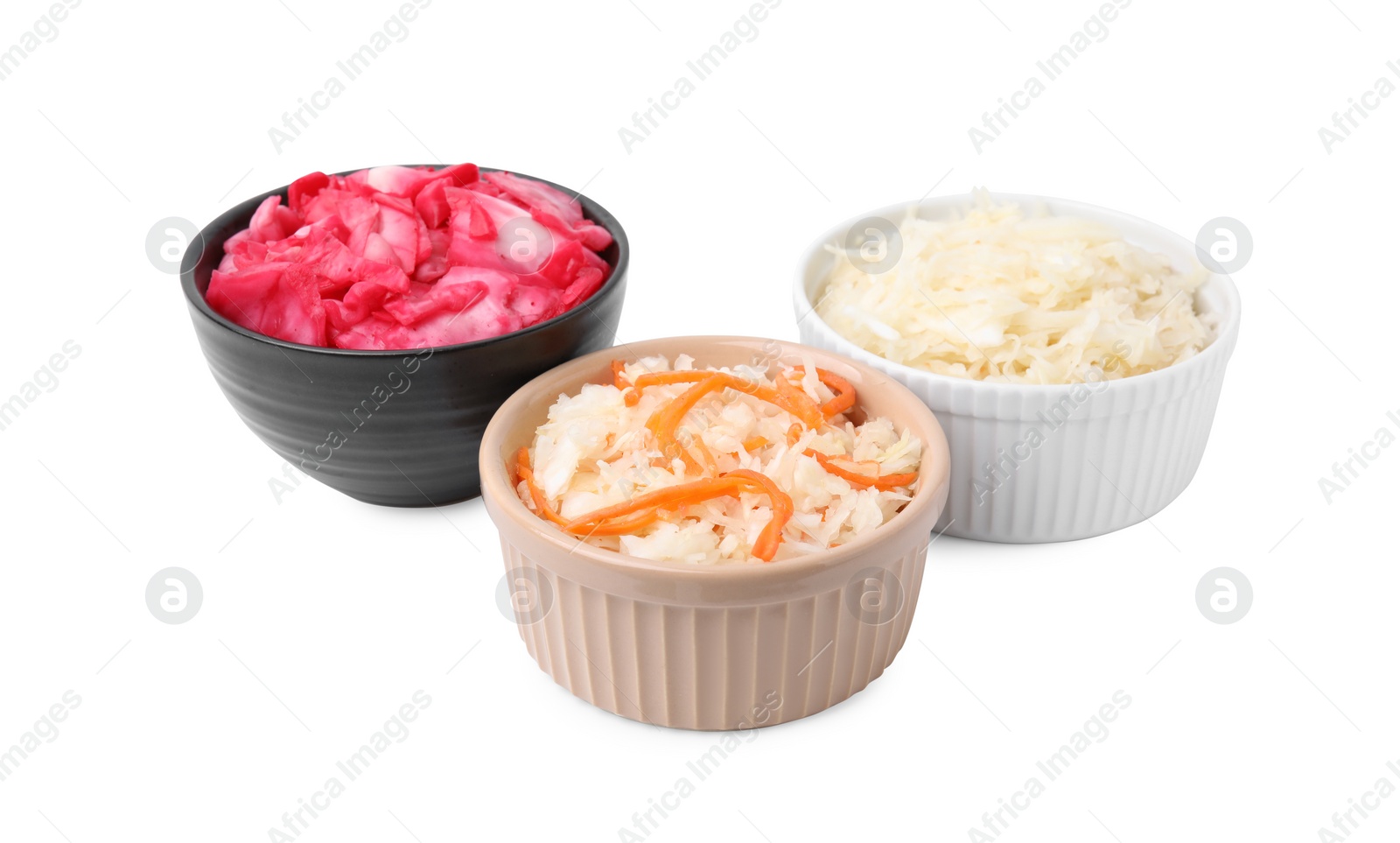 Photo of Delicious sauerkraut prepared according to different recipes on white background