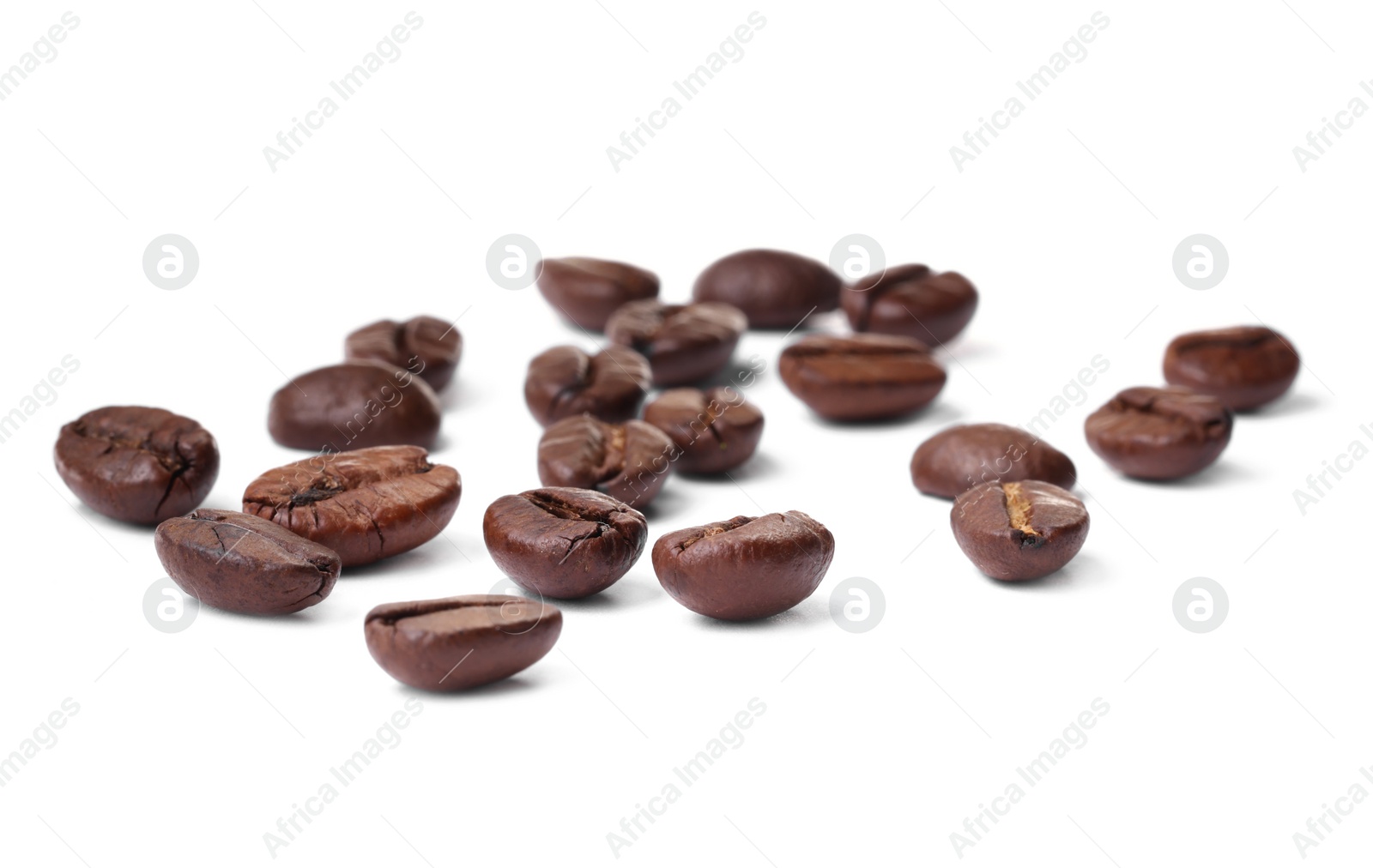 Photo of Many roasted coffee beans isolated on white