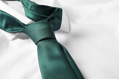 Photo of Color male necktie on white shirt, closeup