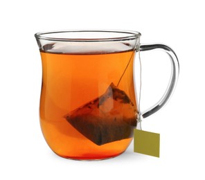 Photo of Tea bag in glass cup of hot water isolated on white