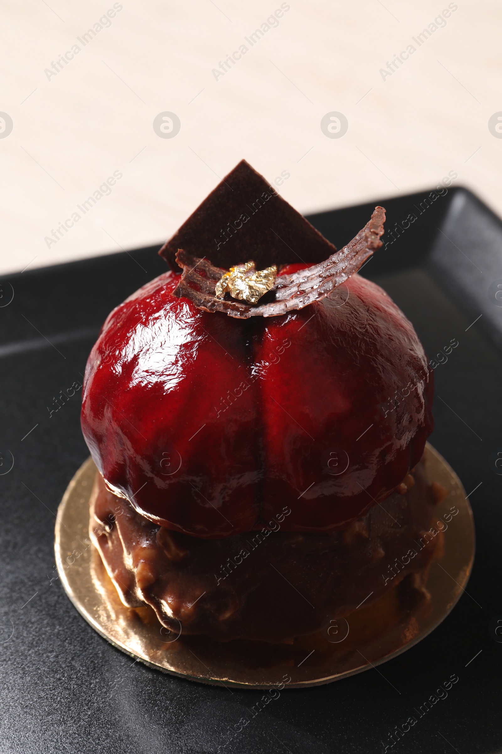 Photo of Delicious nutty dessert with chocolate on plate, closeup