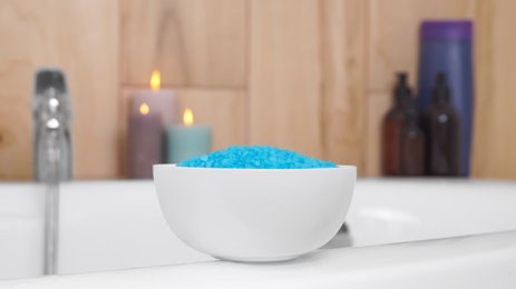 Photo of Bowl with sea salt on white bath