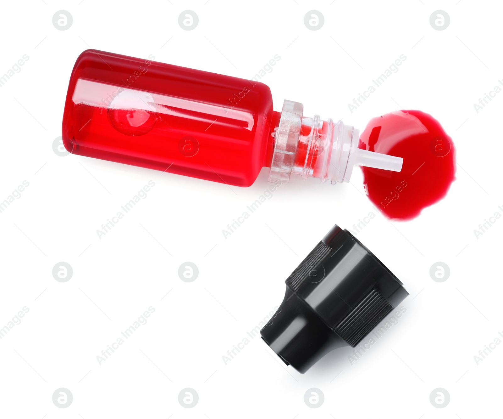Photo of Bottle with red food coloring isolated on white, top view