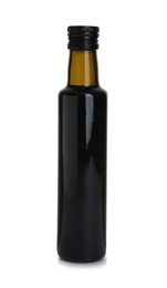 Photo of Bottle with balsamic vinegar on white background