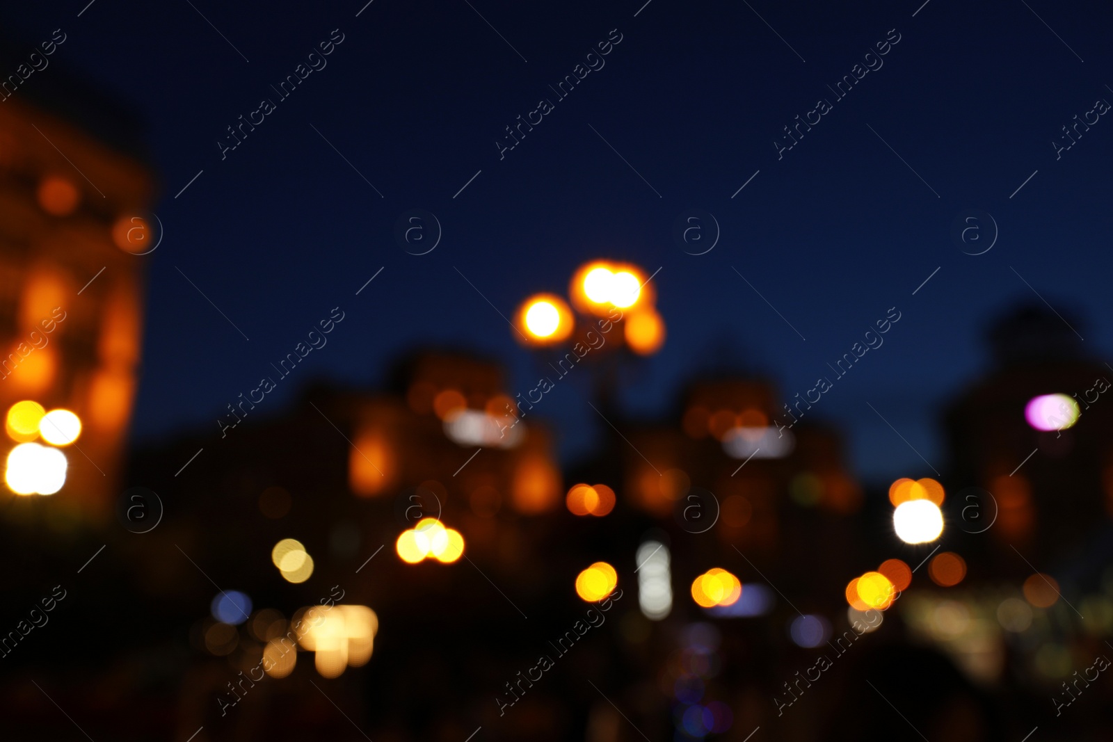 Photo of Blurred view of beautiful city at night. Bokeh effect