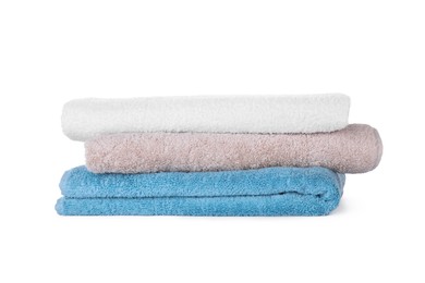 Folded fresh clean towels on white background
