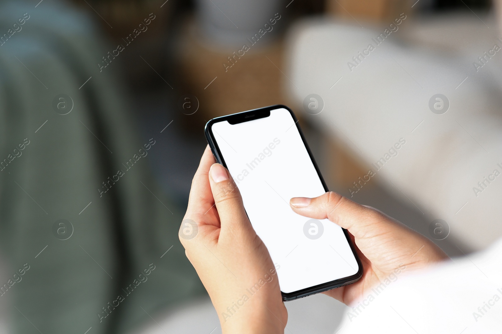 Photo of Closeup view of woman with smartphone indoors. Space for text