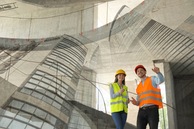 Image of Double exposure of engineers at construction site and modern buildings