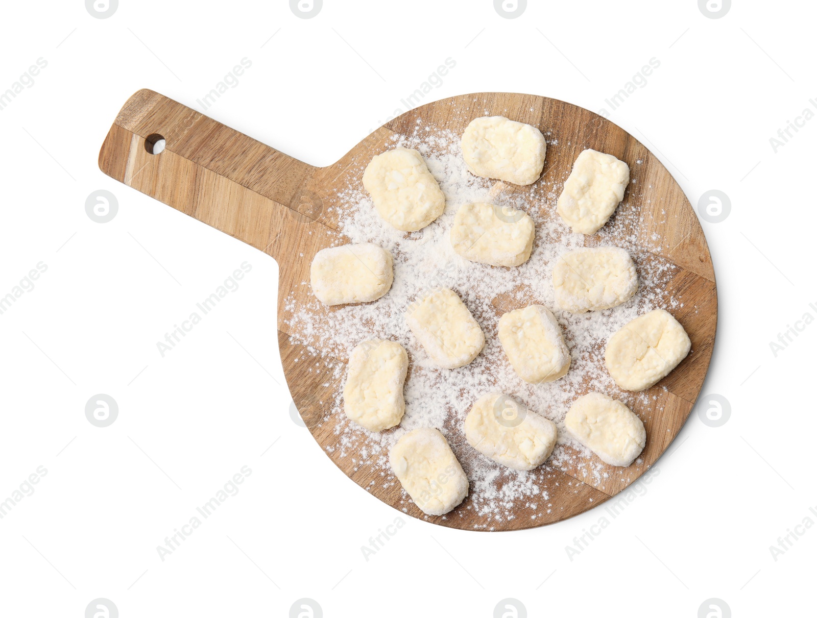 Photo of Making lazy dumplings. Wooden board with cut dough and flour isolated on white, top view