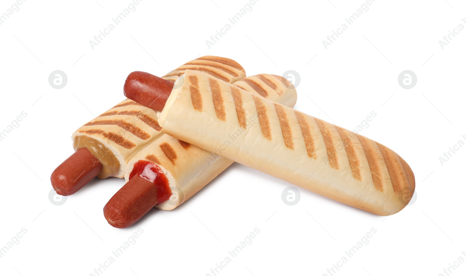 Photo of Tasty french hot dogs with different sauces on white background