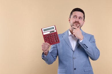 Photo of Thoughtful accountant with calculator on beige background. Space for text