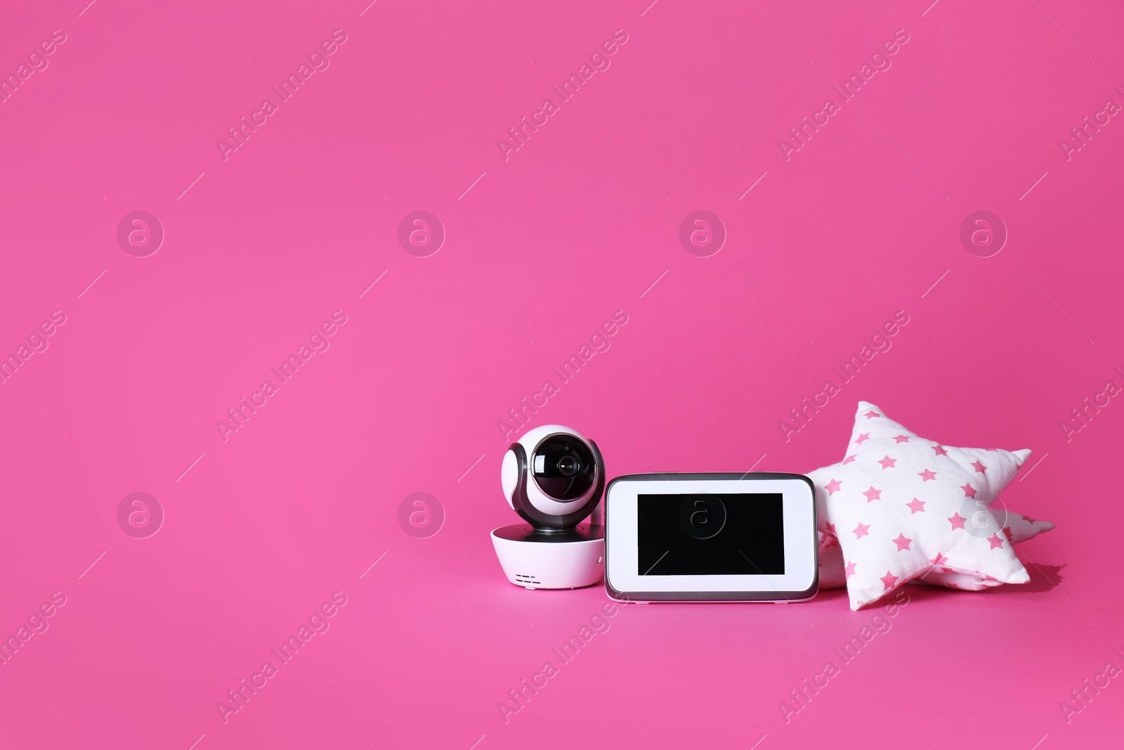 Photo of Modern CCTV security camera, monitor and soft toy on color background. Space for text
