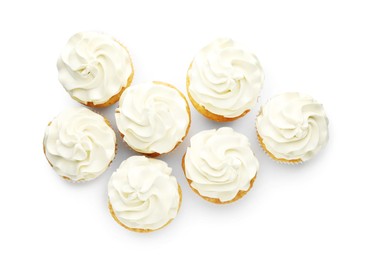 Photo of Tasty vanilla cupcakes with cream isolated on white, top view