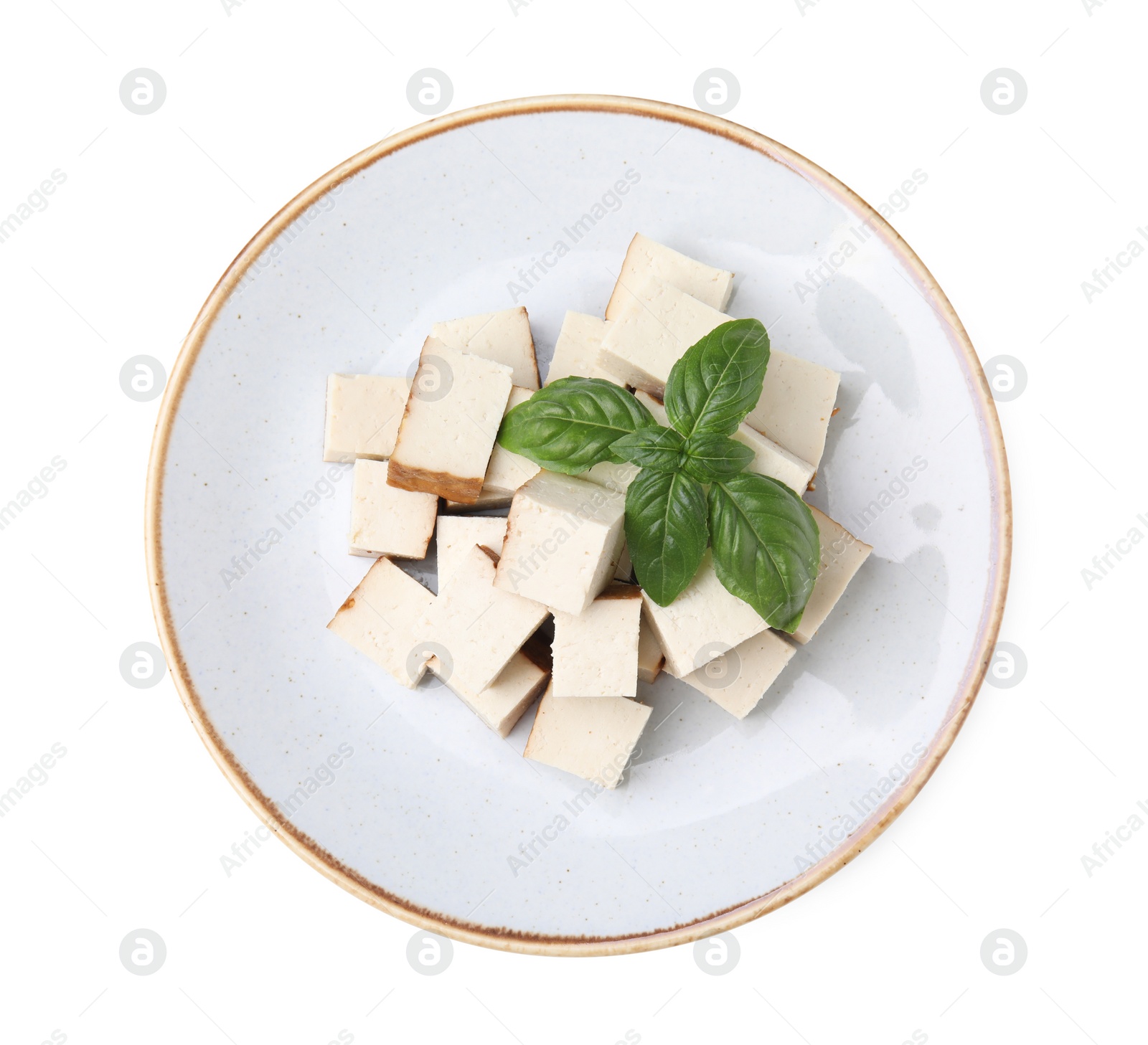 Photo of Plate with delicious fried tofu and basil on white background, top view