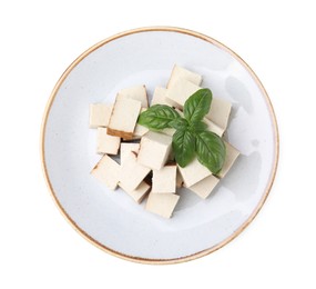 Photo of Plate with delicious fried tofu and basil on white background, top view