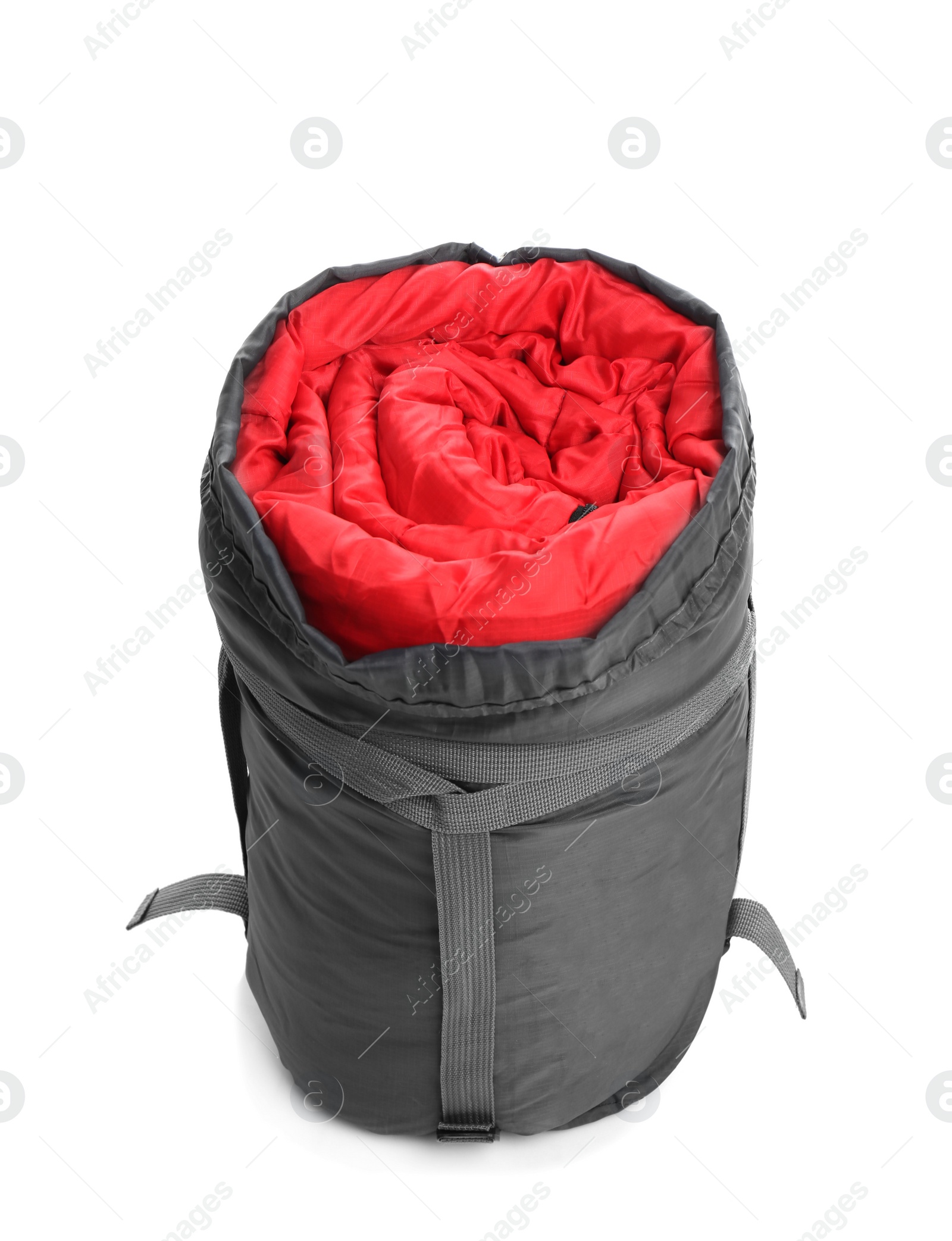 Photo of Sleeping bag in case on white background. Camping equipment