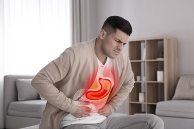 Image of Man suffering from heartburn at home. Stomach with hot chili pepper symbolizing acid indigestion, illustration