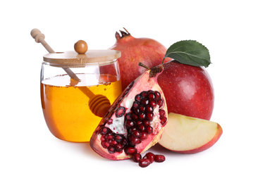 Photo of Honey, apples and pomegranates on white background. Rosh Hashanah holiday