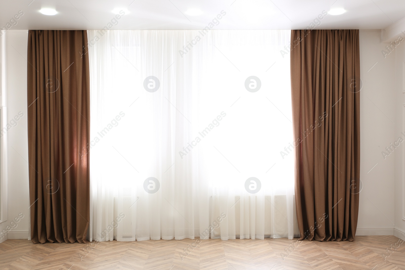 Photo of Windows with elegant curtains in modern room