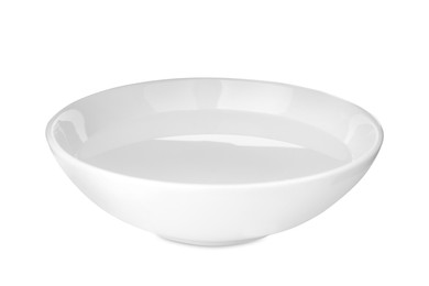 Photo of Ceramic bowl full of water isolated on white