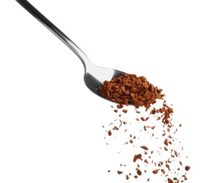 Photo of Pouring aromatic instant coffee from spoon on white background