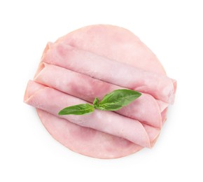 Photo of Rolled slices of tasty ham and basil isolated on white, top view