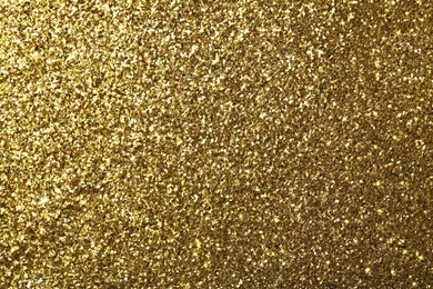 Image of Beautiful shiny golden glitter as background, closeup