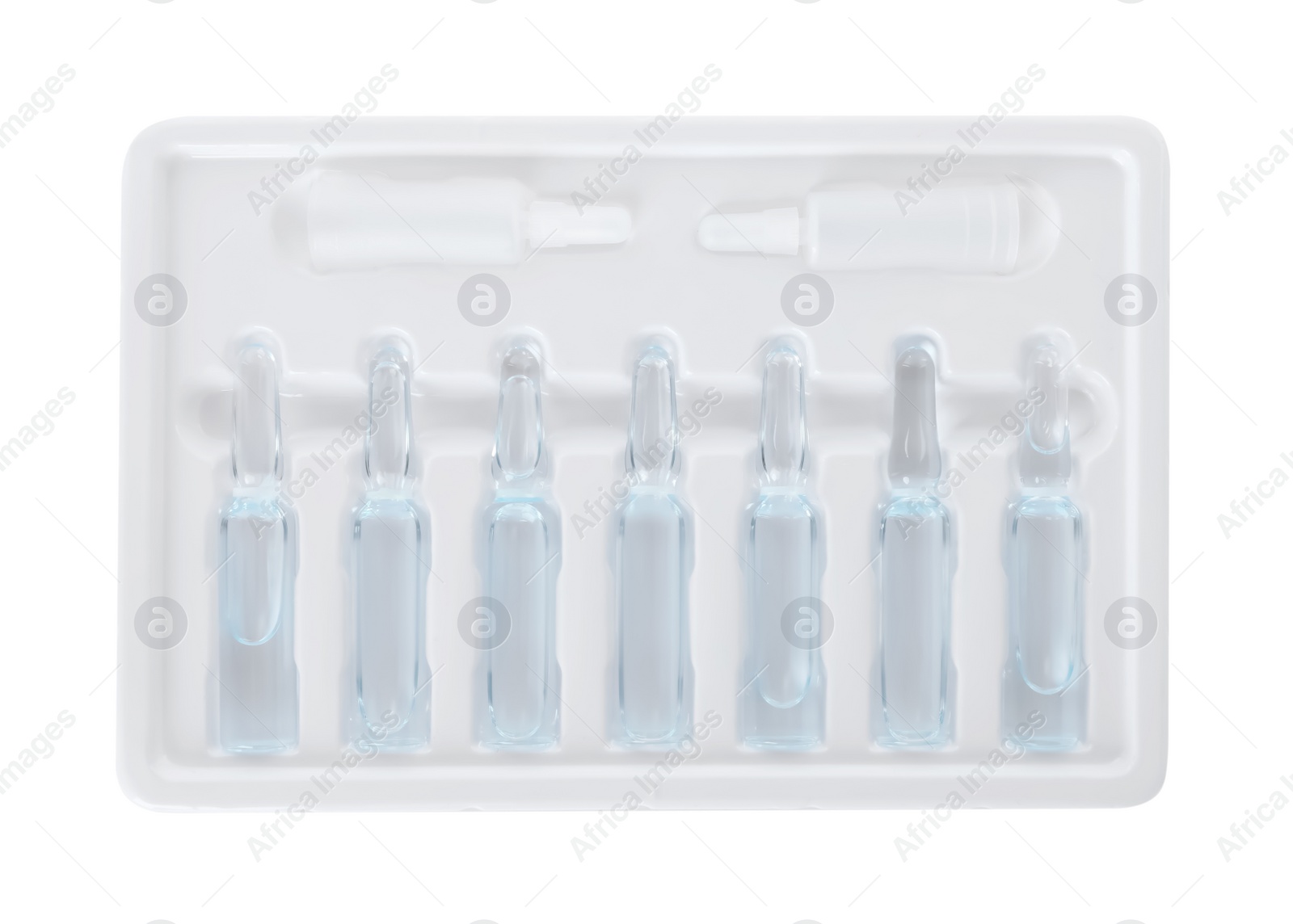 Photo of Glass ampoules with pharmaceutical product in tray on white background, top view