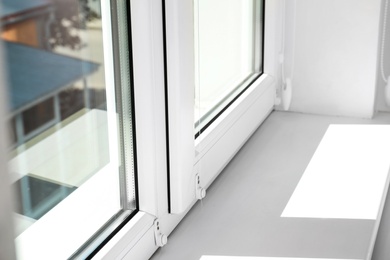 Photo of Modern window indoors, closeup view. Home interior