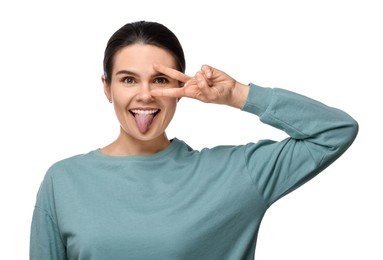 Photo of Happy young woman showing her tongue on white background