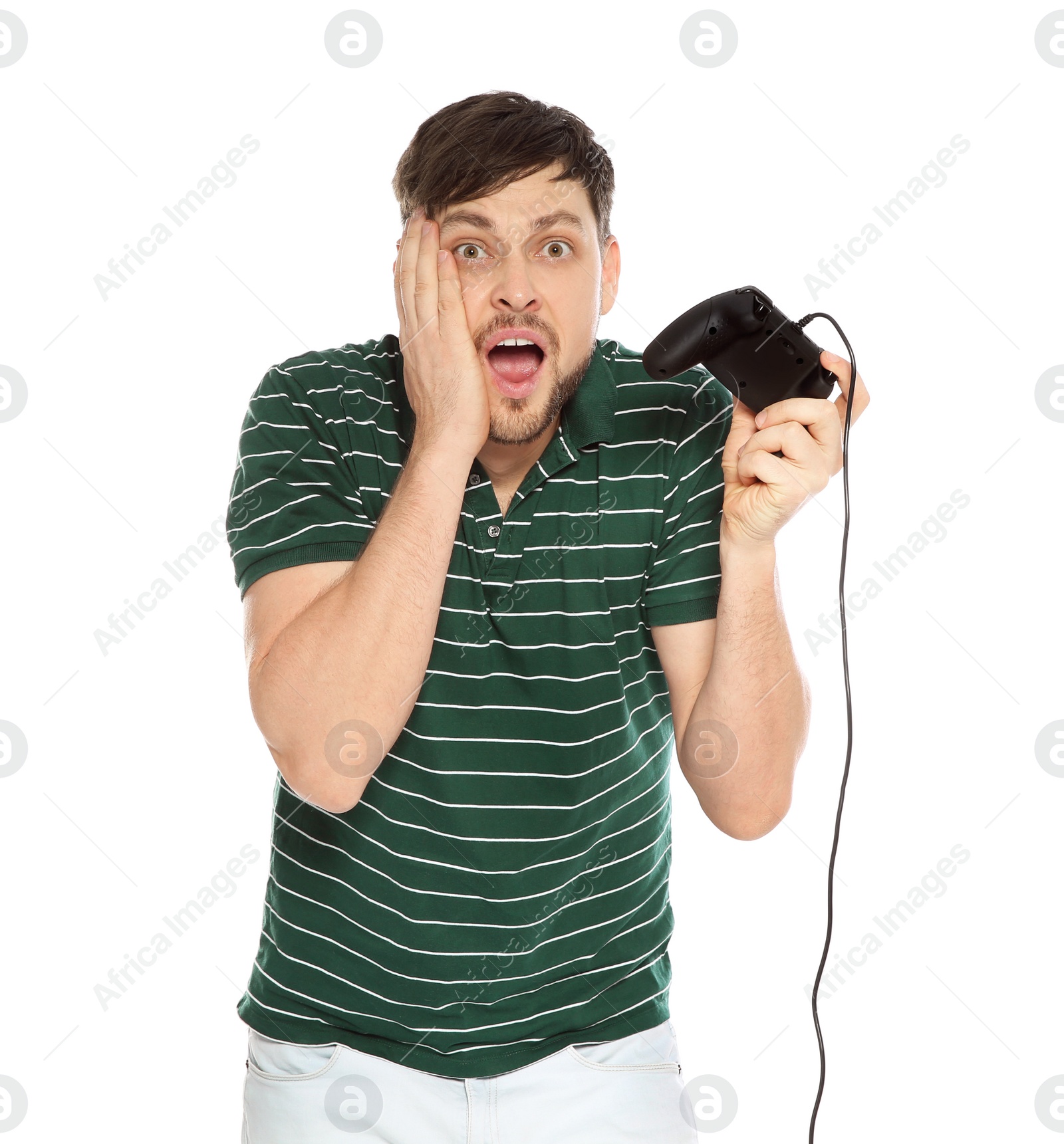 Photo of Emotional man playing video games with controller isolated on white