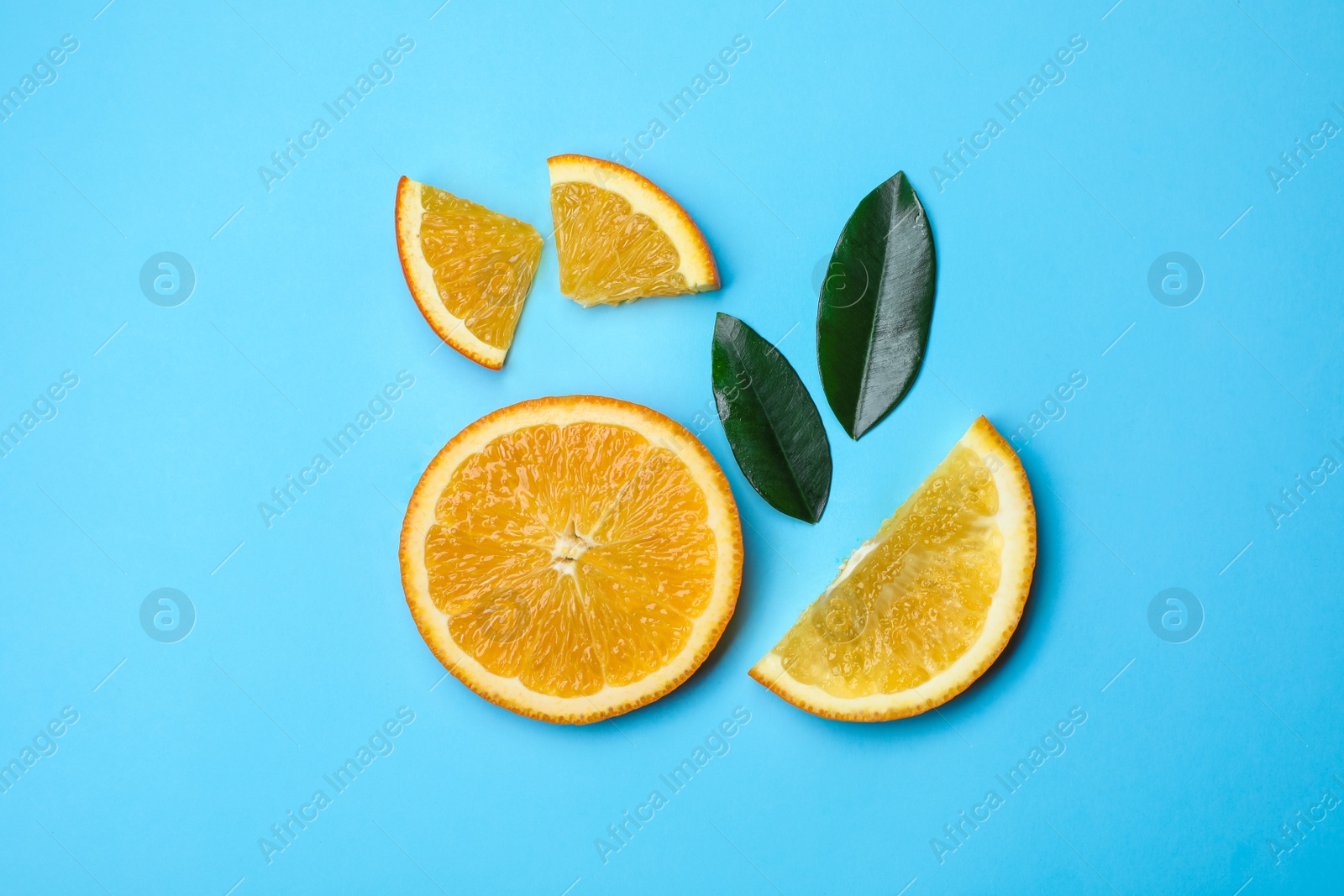 Photo of Flat lay composition with fresh oranges on color background