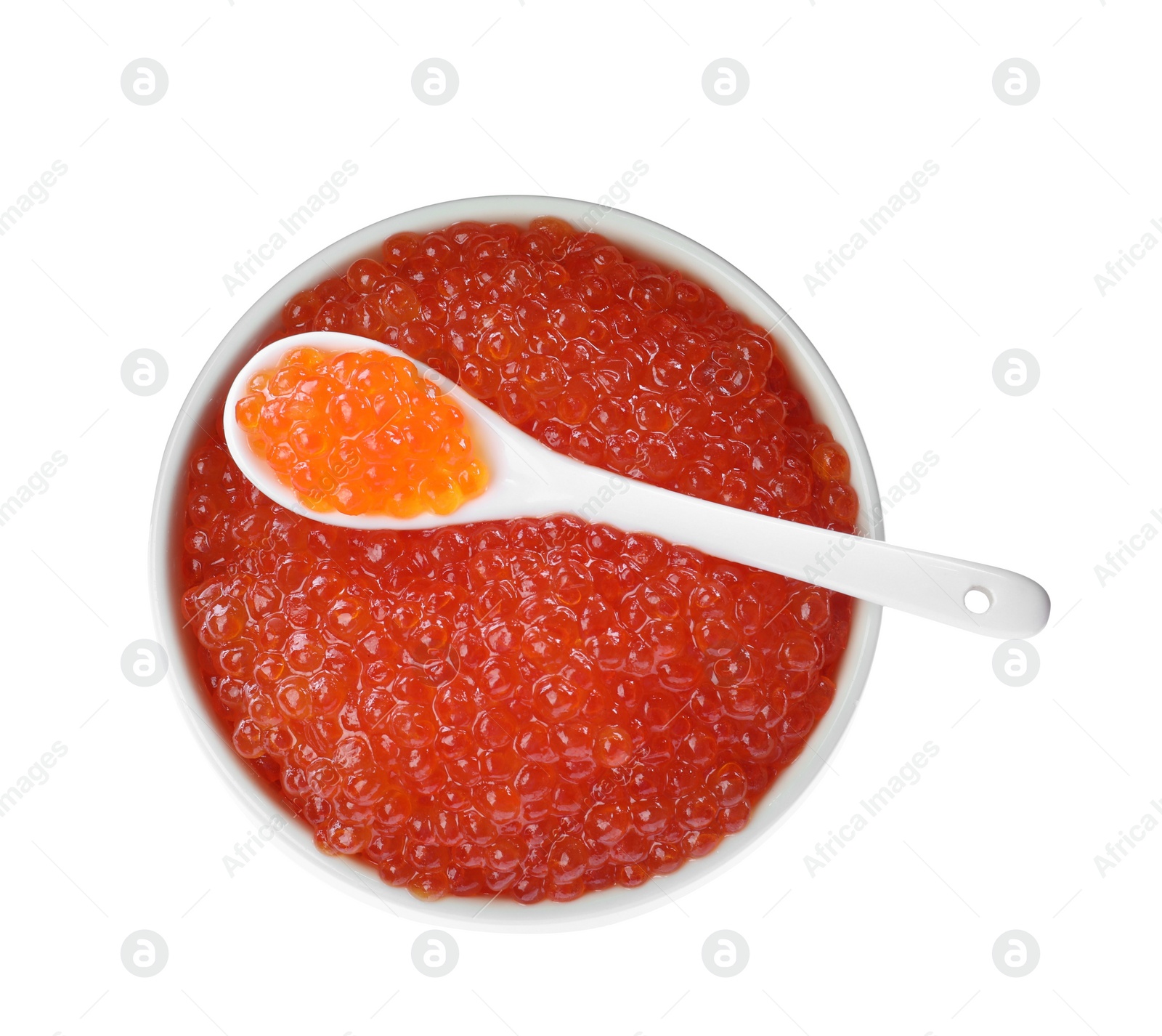 Photo of Bowl and spoon with delicious red caviar isolated on white, top view