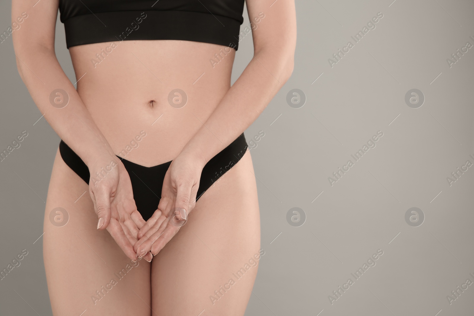 Photo of Gynecology. Woman in underwear on grey background, closeup. Space for text