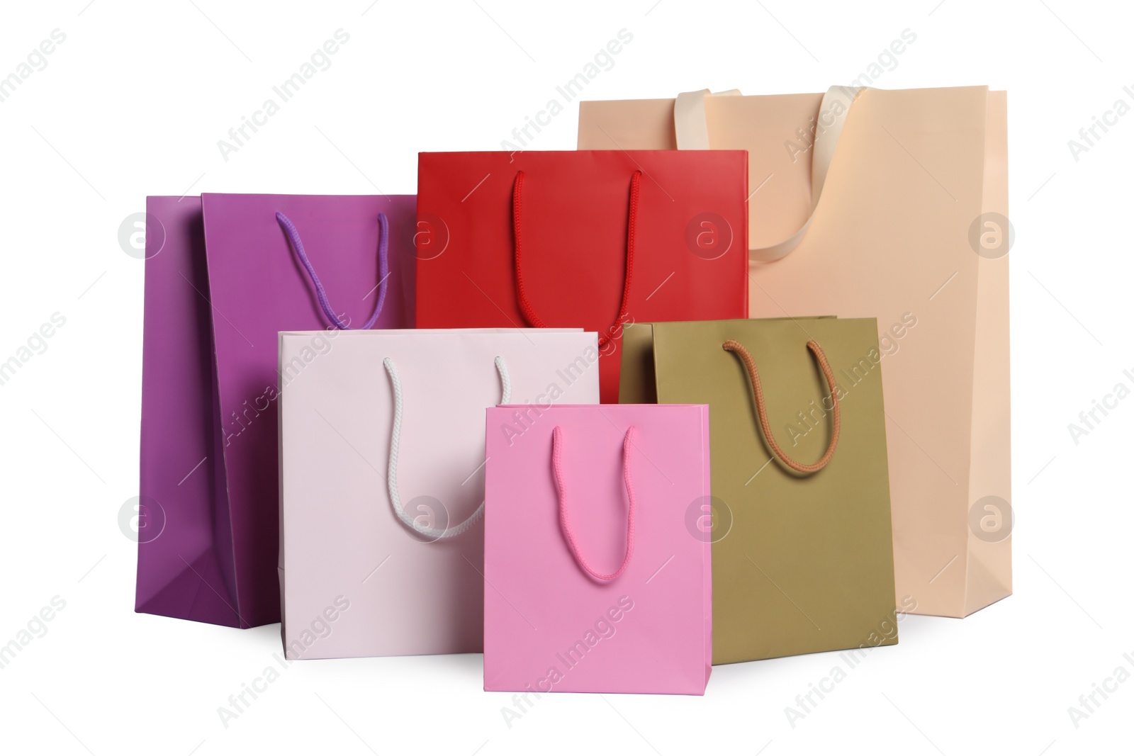 Photo of Colorful paper shopping bags isolated on white