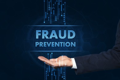 Image of Fraud prevention. Man holding words and illustrations on blue background, closeup