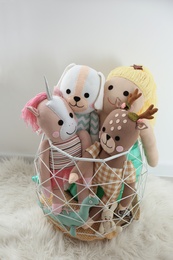 Funny toys in basket on floor. Decor for children's room interior