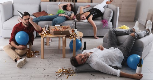 Image of Drunk friends sleeping in messy room after party. Banner design