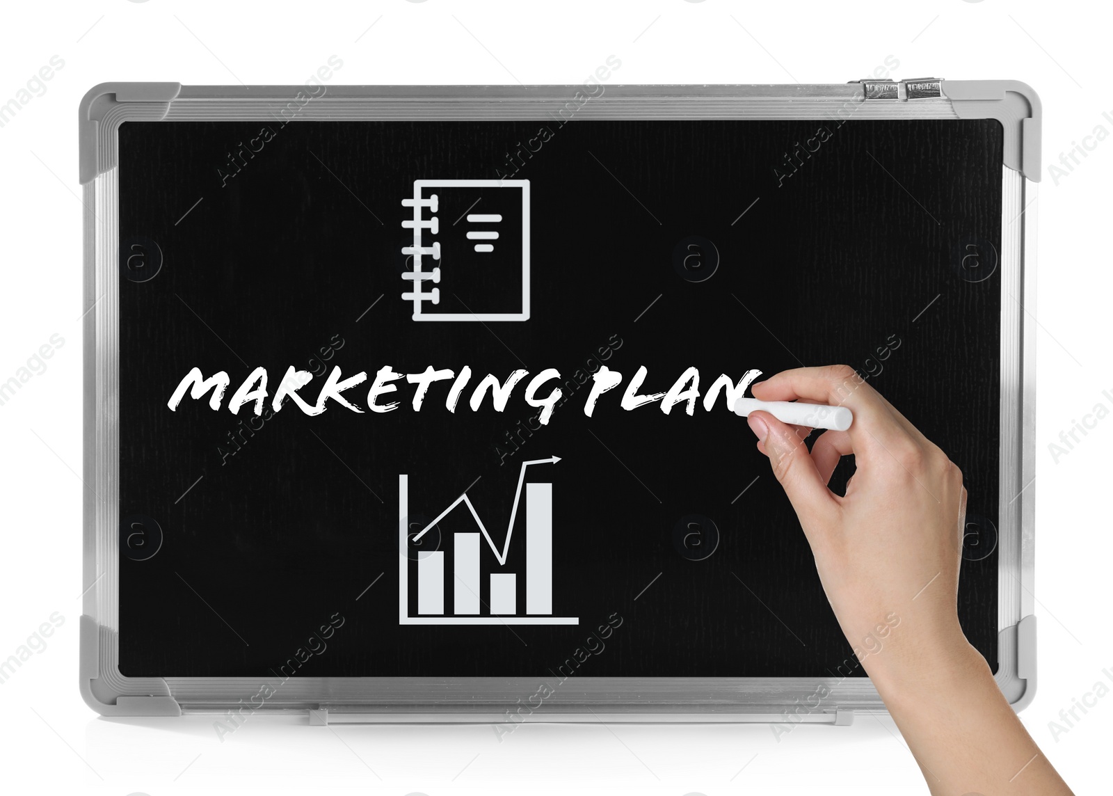 Image of Woman writing marketing plan on small blackboard, closeup