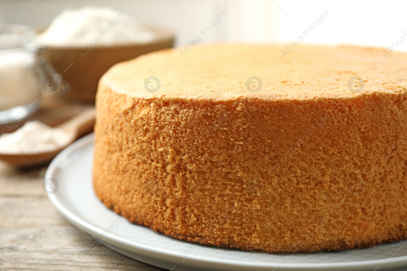 Photo of Delicious fresh homemade cake on wooden table, closeup