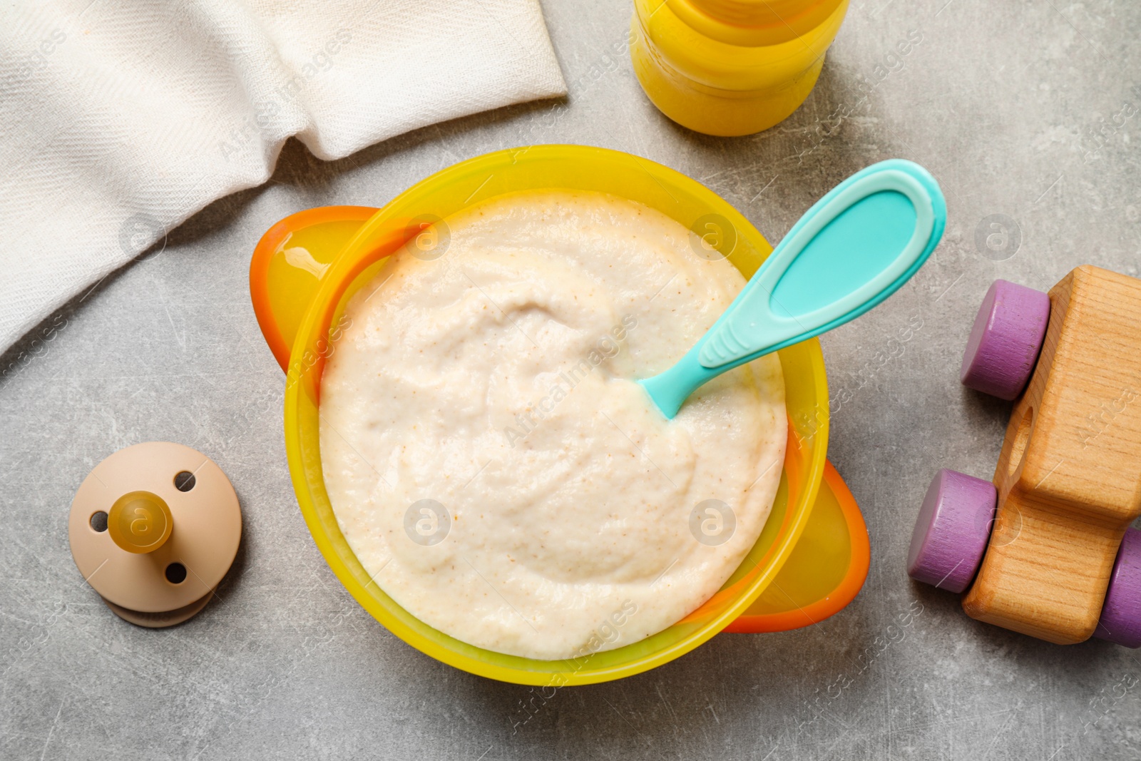 Photo of Flat lay composition with healthy baby food on grey table